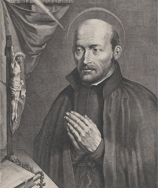 Saint Ignatius of Loyola, praying towards the left with a crucifix, a rosary, a book, and a skull on the table in front of him